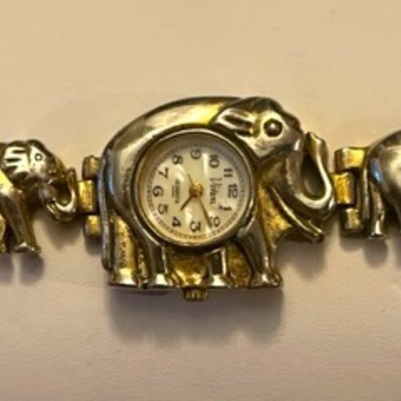 Jewelry - Elephants linked trunk to tail stainless steel watch, now a bracelet.